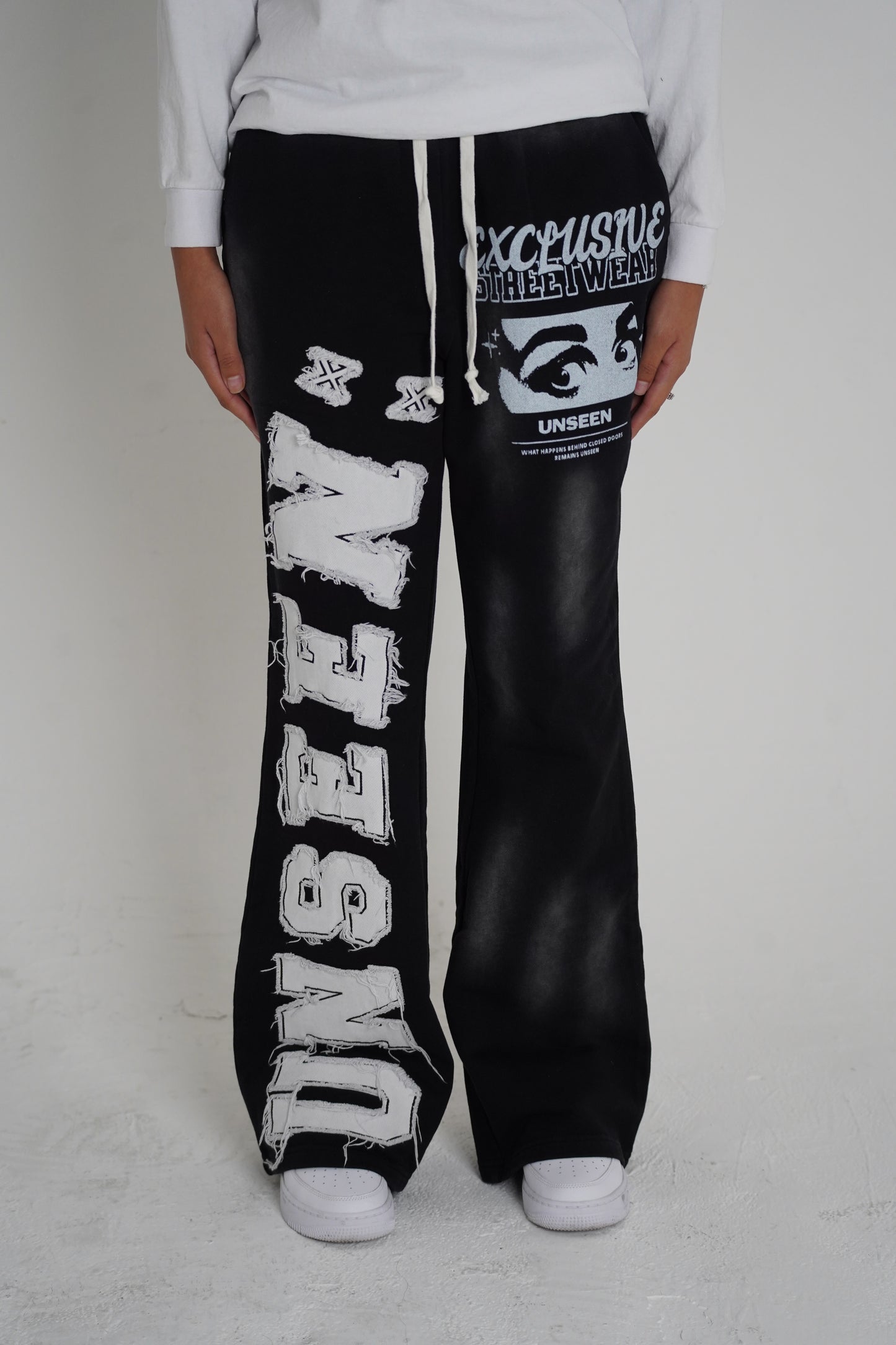 Black Unseen Flared Sweatpants